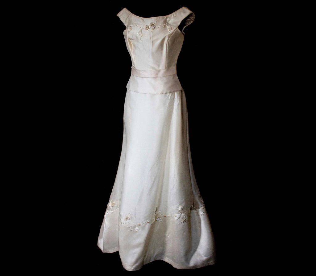Elegant vintage silk organza bridal set by Vague Atelier featuring a bateau top and A-line skirt with back bow, perfect fo...