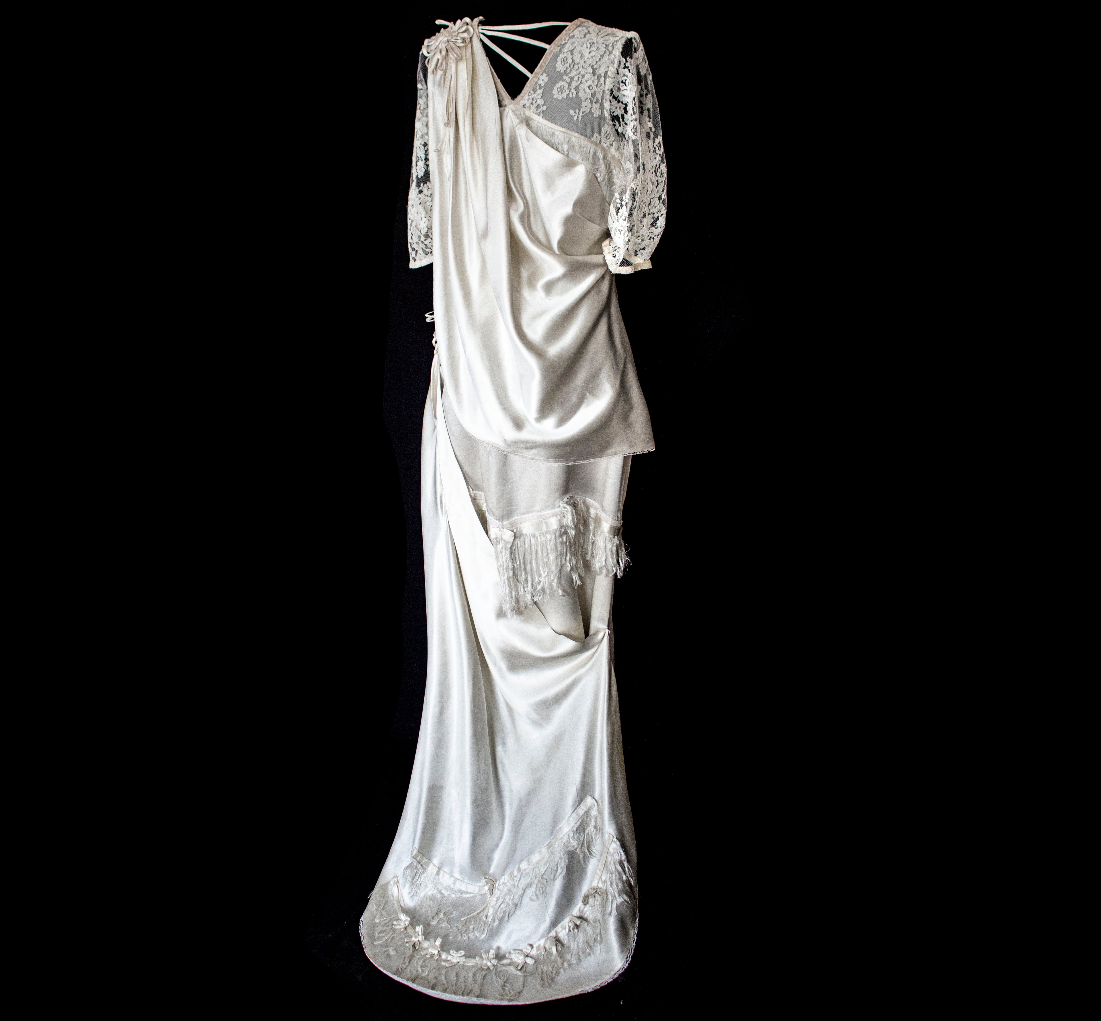 263 - MUSEUM QUALITY 1920S ANTIQUE BRIDAL GOWN: RESTORED ART DECO SILK SATIN & LACE DRESS WITH FRINGES